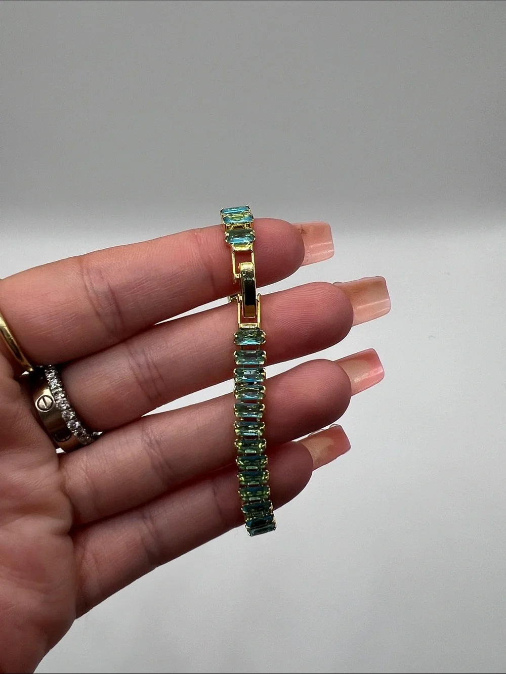 524. 18k Gold Plated over Brass Bracelet with Aquamarine Cubic Zirconias 7”